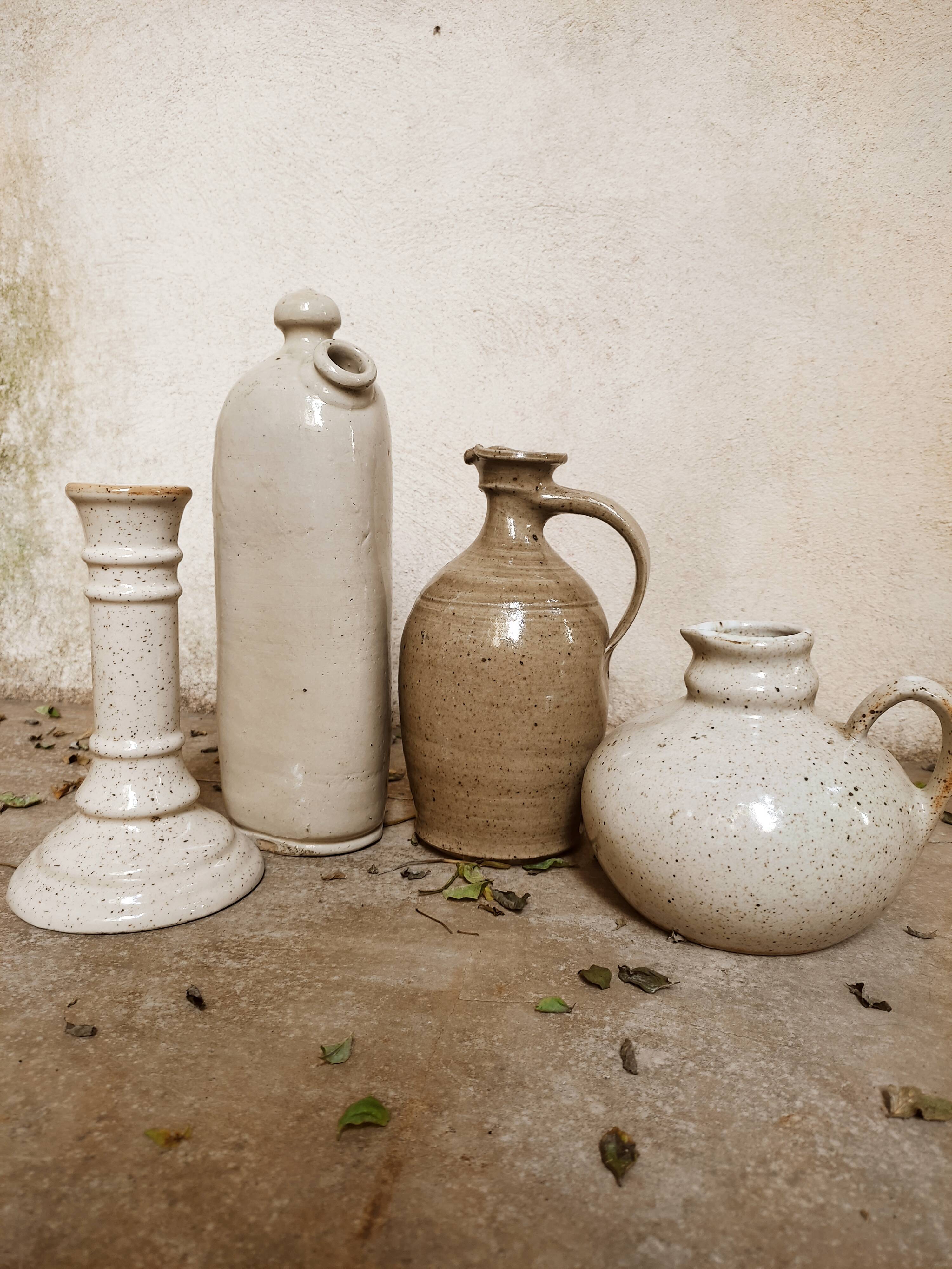 Stoneware decanters and candle holder