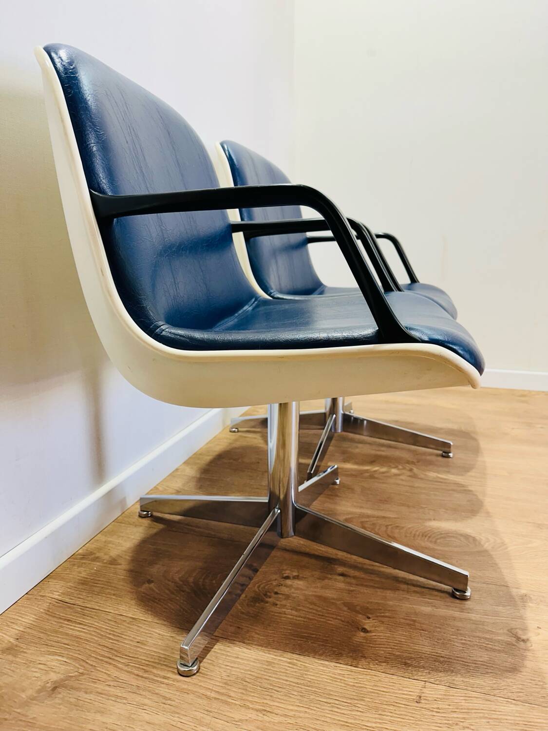 2 office chairs attr. to Strafor, white molded plastic shell, blue skai and chrome metal star base