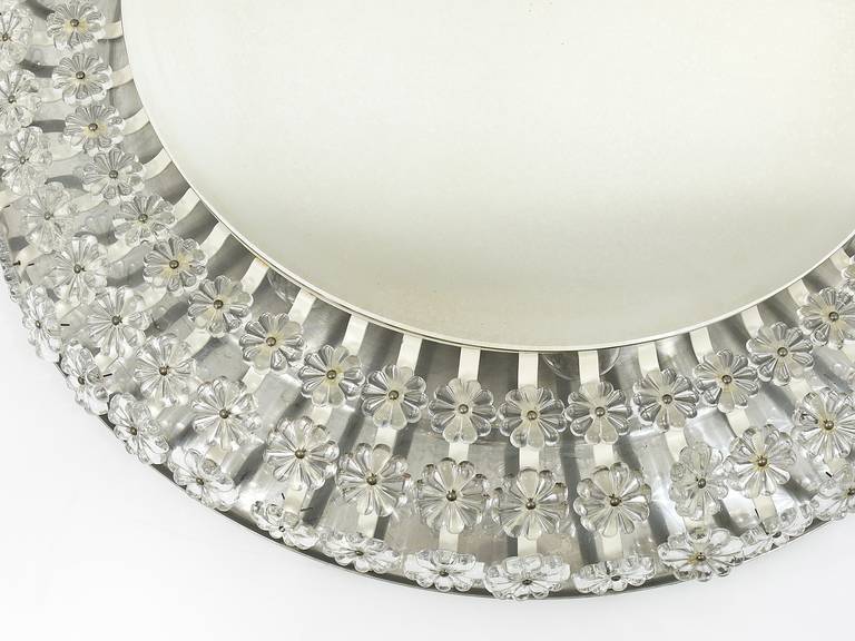 Large round wall mirror with glass flowers by Emil Stejnar, backlit by Nikoll, Austria.