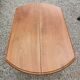 Table ovale 6 pieds avec allonges patine caramel