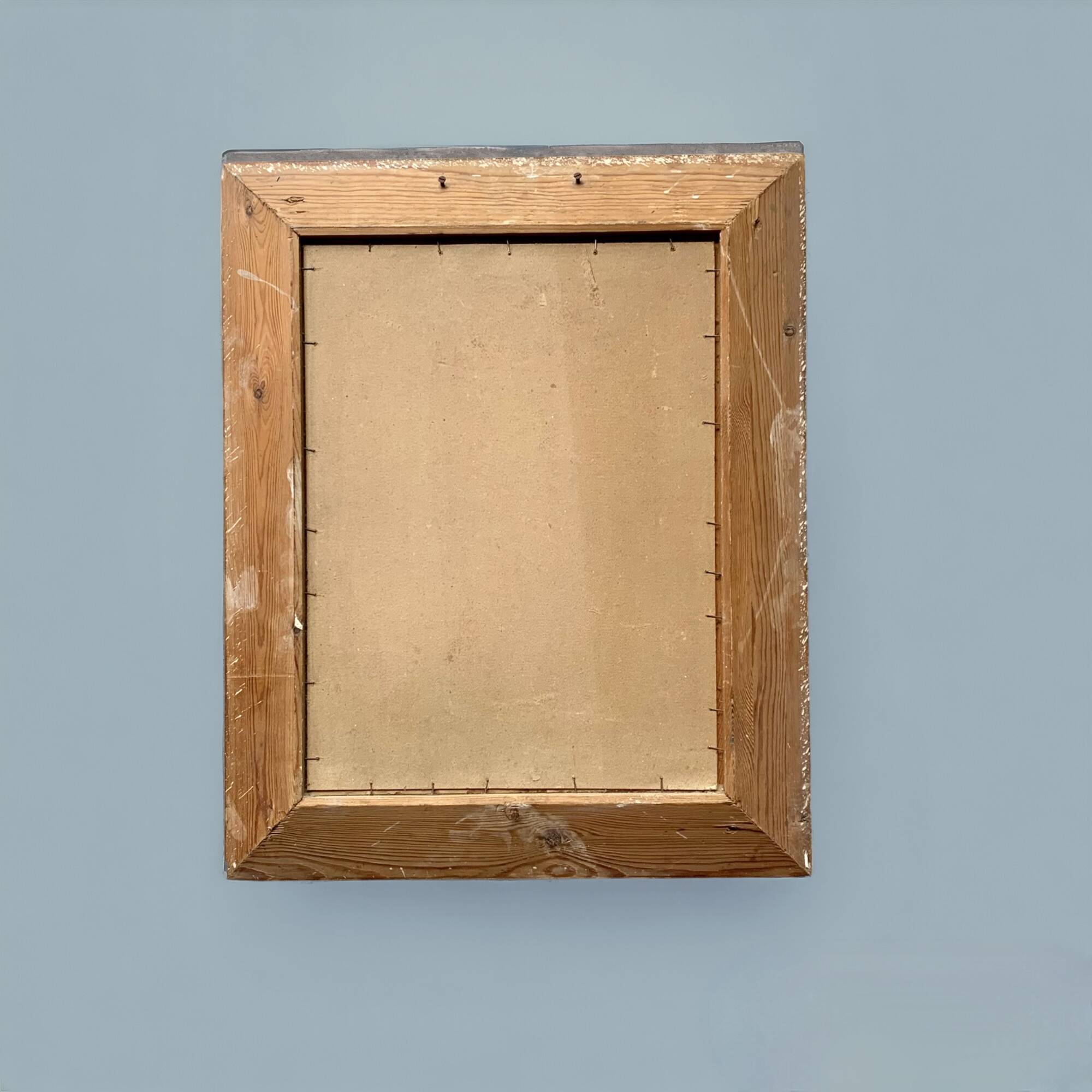 Old wall frame in carved gilded wood