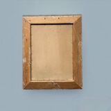 Old wall frame in carved gilded wood