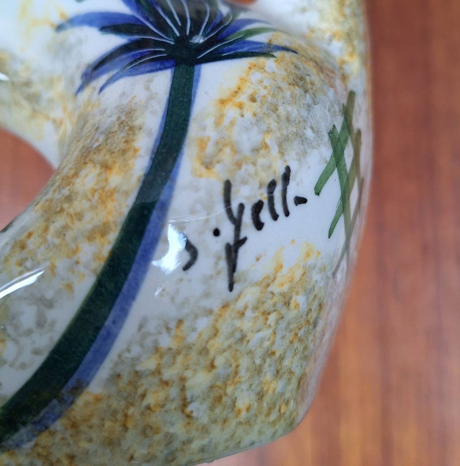 Earthenware vase signed by Jacqueline Gelb with a thistle decoration.