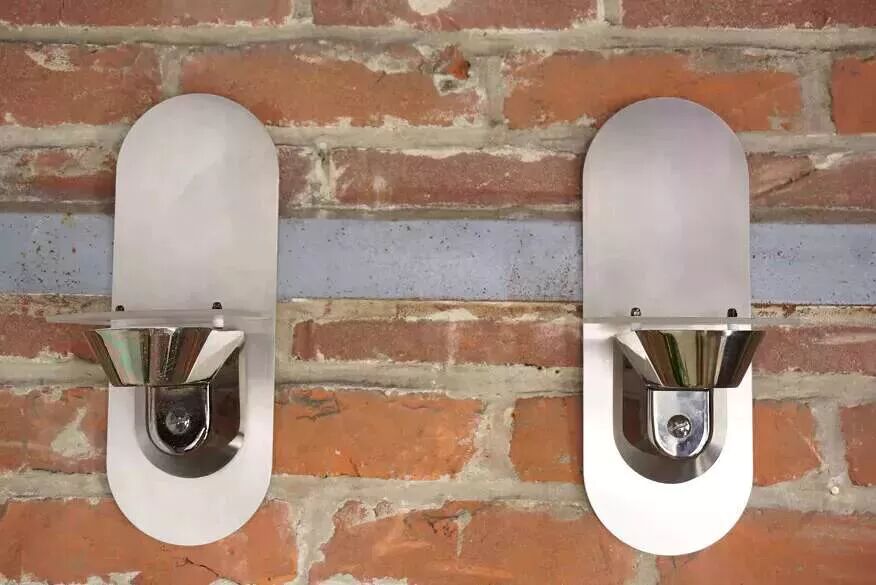 Pair of stainless steel and glass wall lights