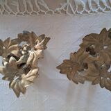 Pair of antique candlesticks with a floral design.