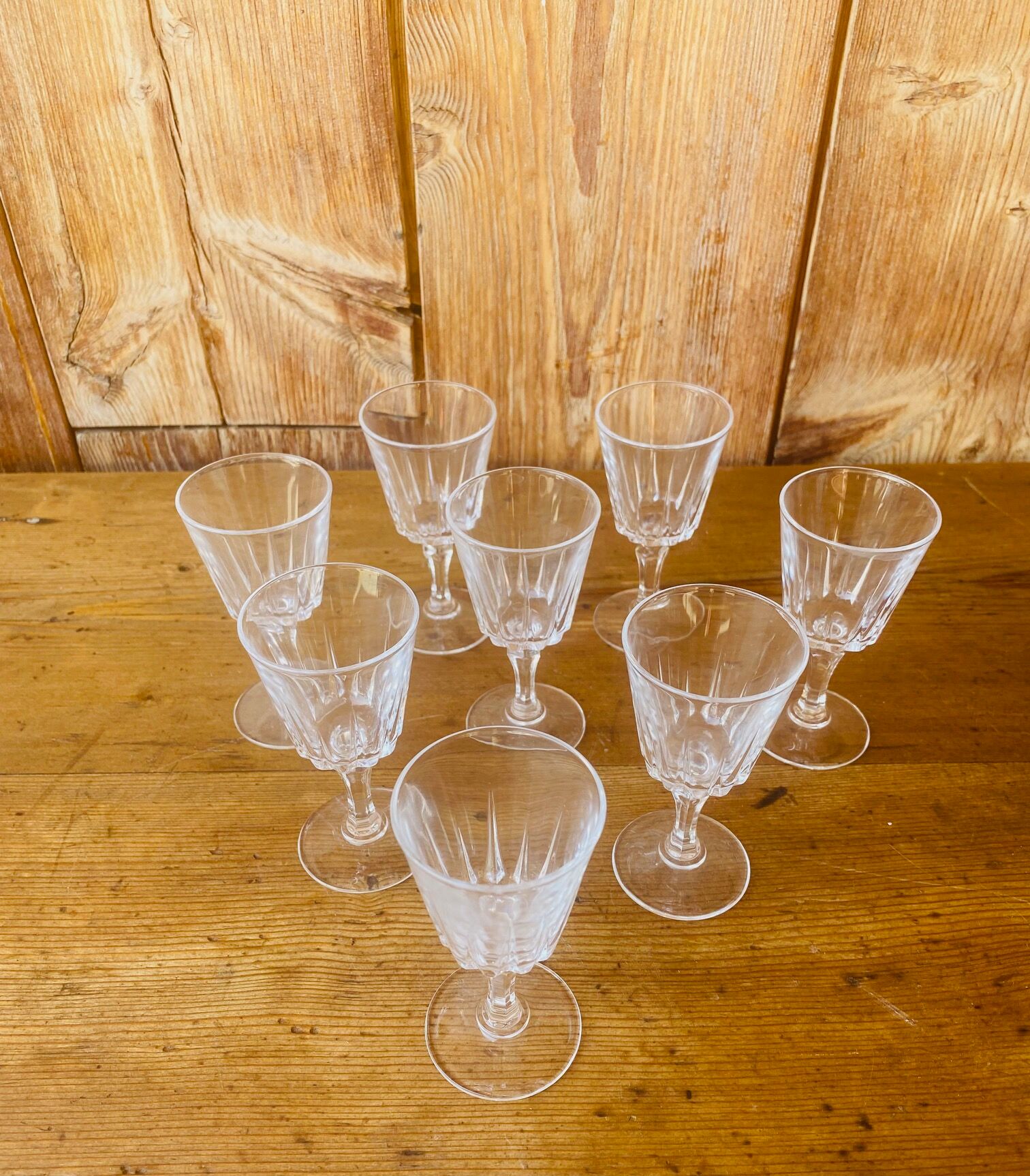 Set of 8 small glasses on foot in transparent glass
