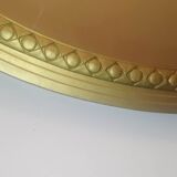 Oval mirror in wood and gilded plaster with pompom decoration