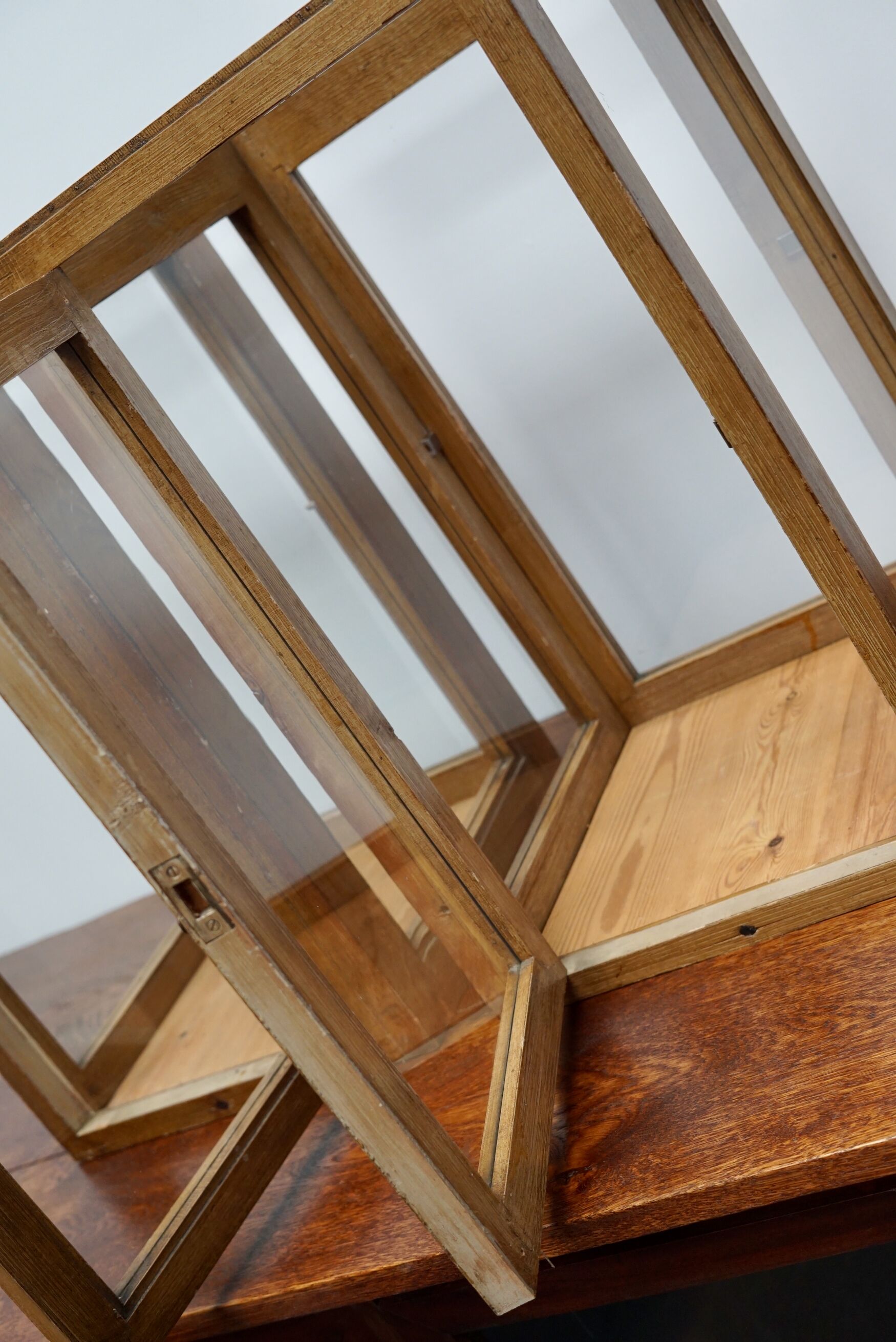 pair of faux oak shop display cabinets, circa 1920s
