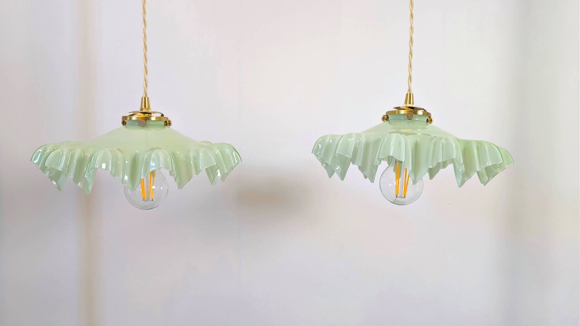 Pair of green opaline glass pendant lights – frosted poetry & Art Deco brilliance