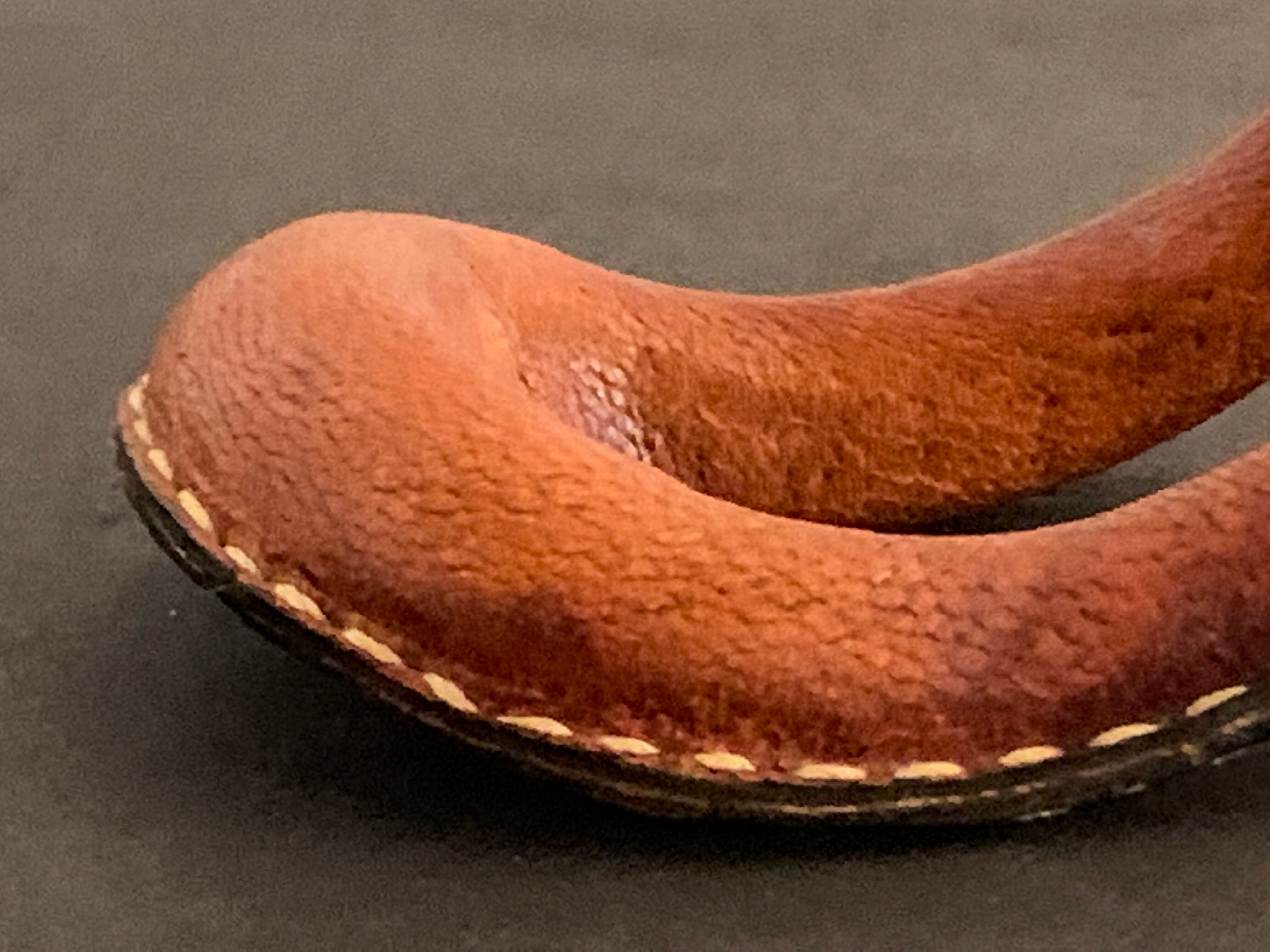 Carl Auböck pipe rack in leather and bronze, 1963