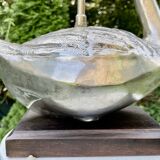 Old vintage lamp representing a duck in silver metal with wooden base