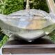 Old vintage lamp representing a duck in silver metal with wooden base