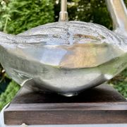 Old vintage lamp representing a duck in silver metal with wooden base