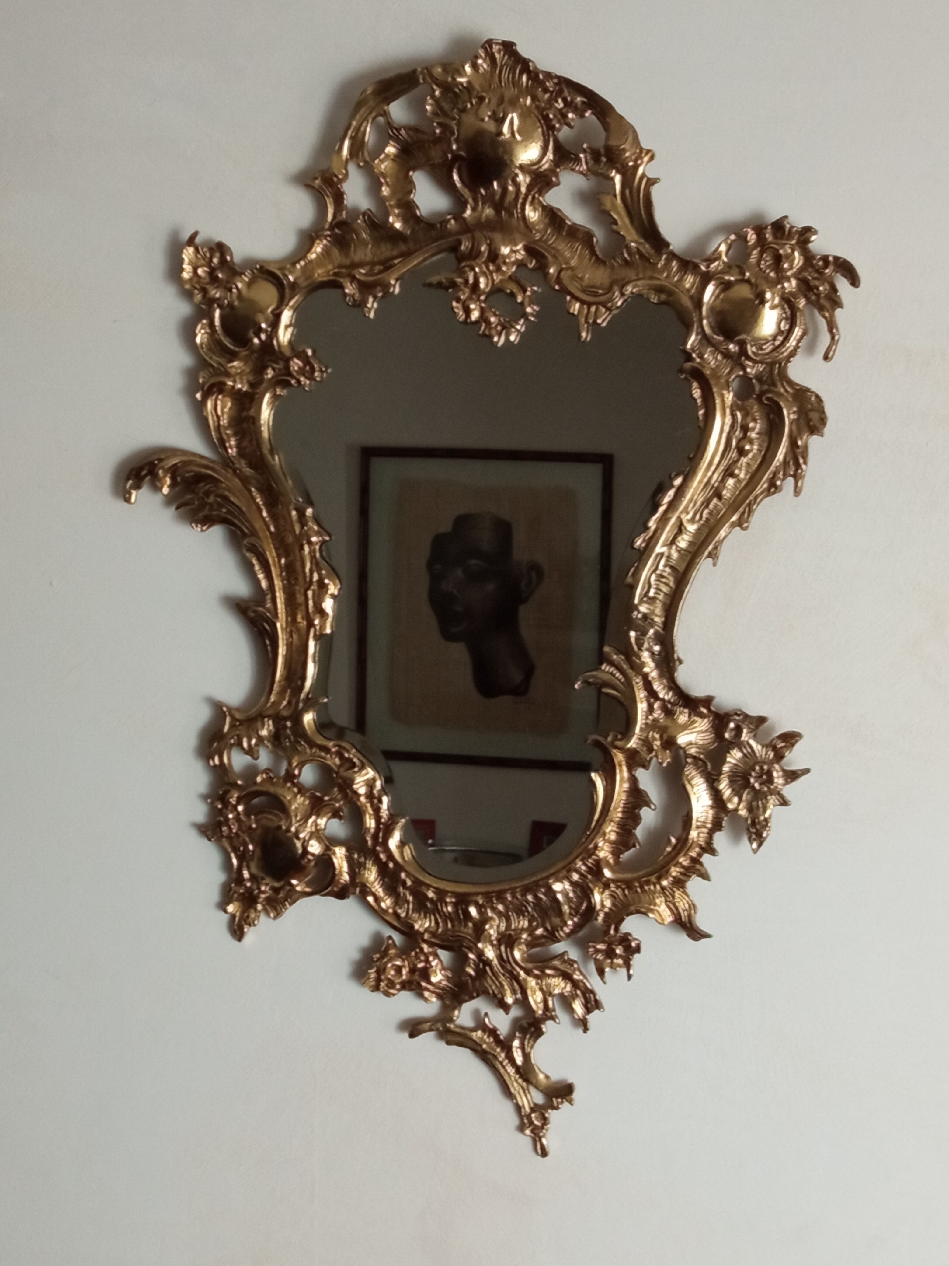 Antique mirror in gilded metal