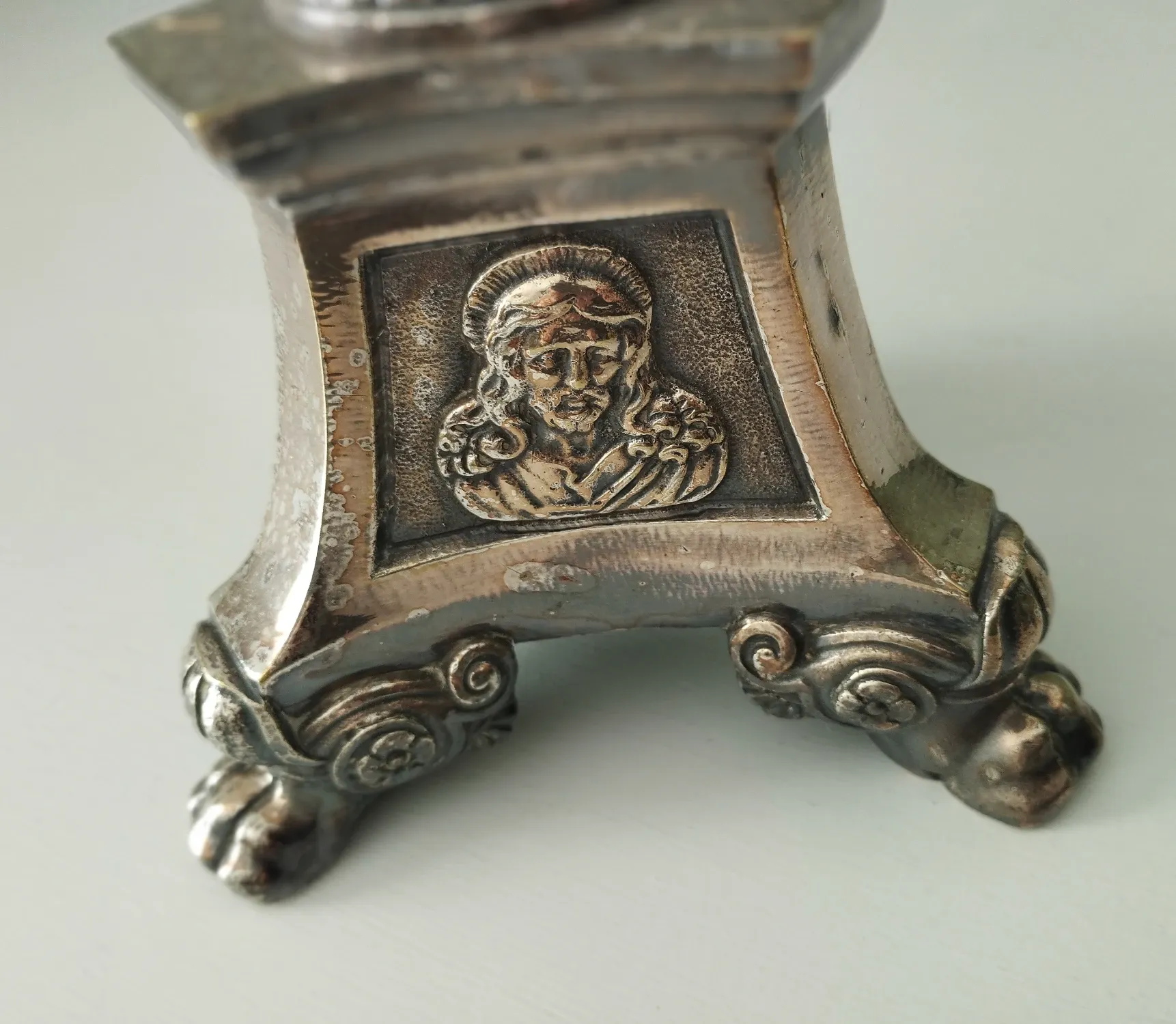 Old church candlestick in silver-plated metal