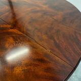 Extendable mahogany round table in Louis XVI style