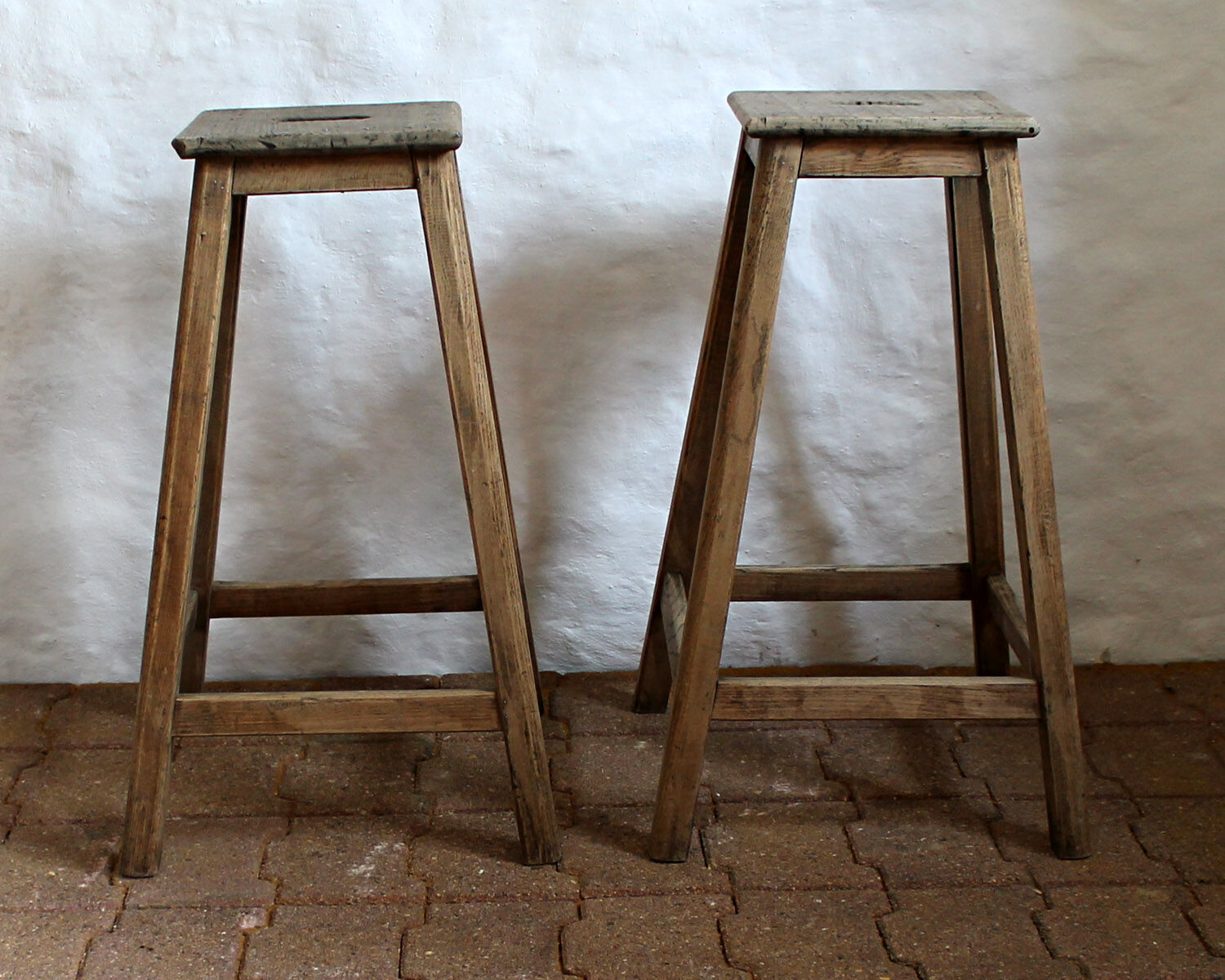 Pair of high workshop stools in raw wood