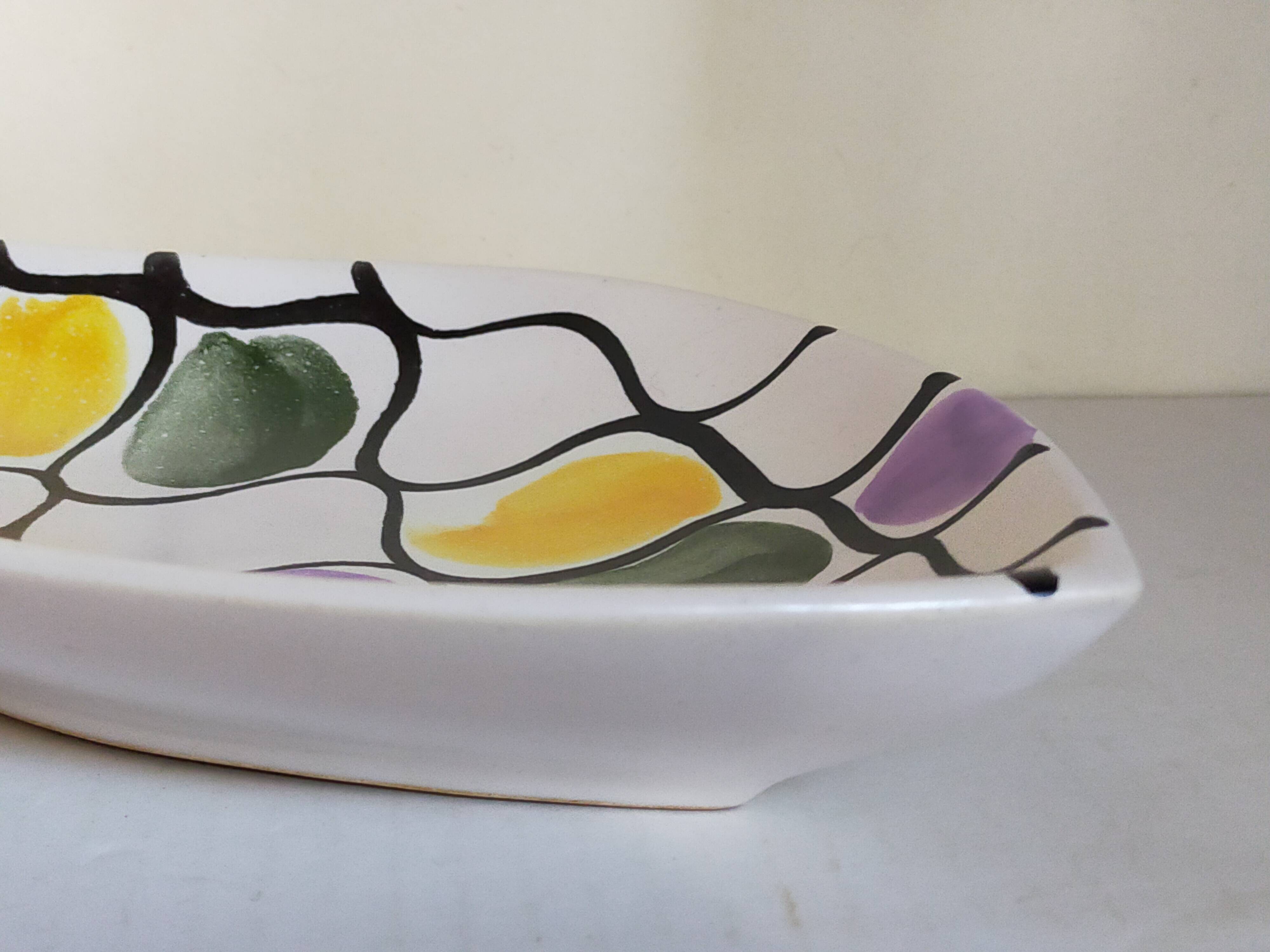 Three vintage free-form ceramic ravine dishes from the 1950s