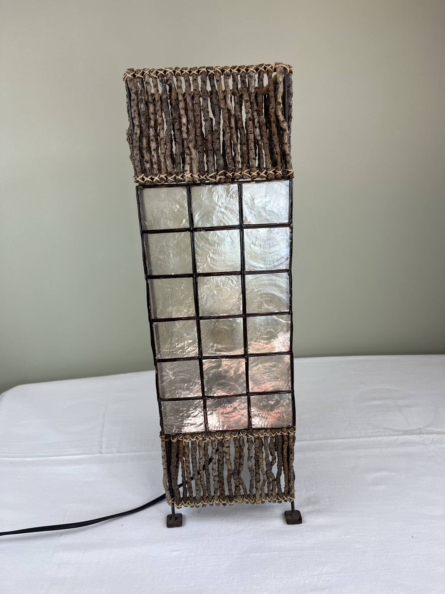 Capiz shell lamp and woven twigs
