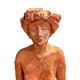 Painted plaster sculpture of a nude woman on a bench