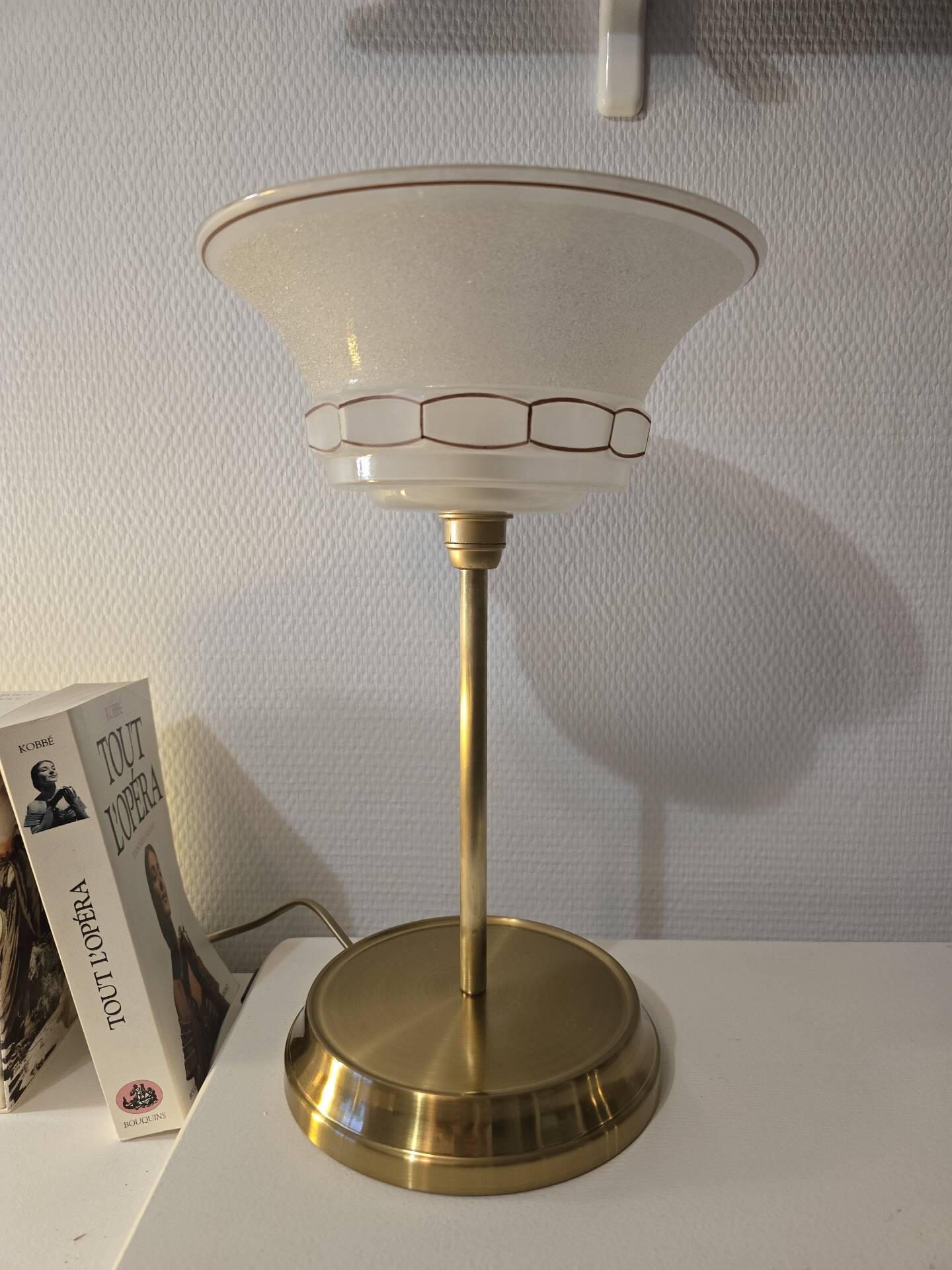 Art Deco table lamps with frosted glass shade and brass base.