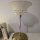Art Deco table lamps with frosted glass shade and brass base.