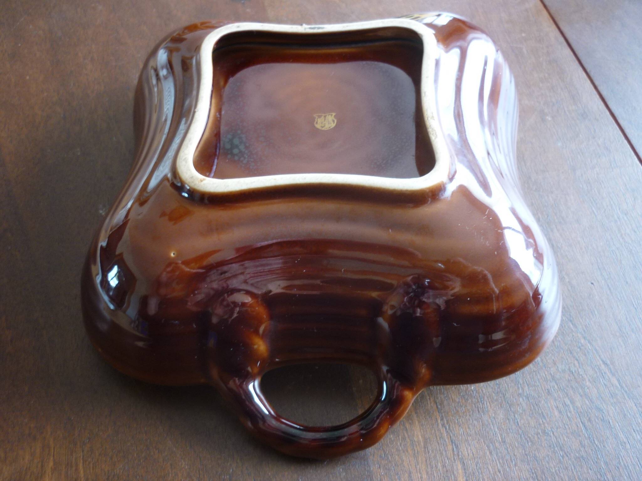 Square dish with brown and gold handles
