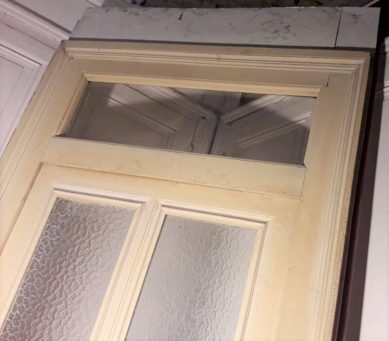 Large glazed door and its old glazed transom.