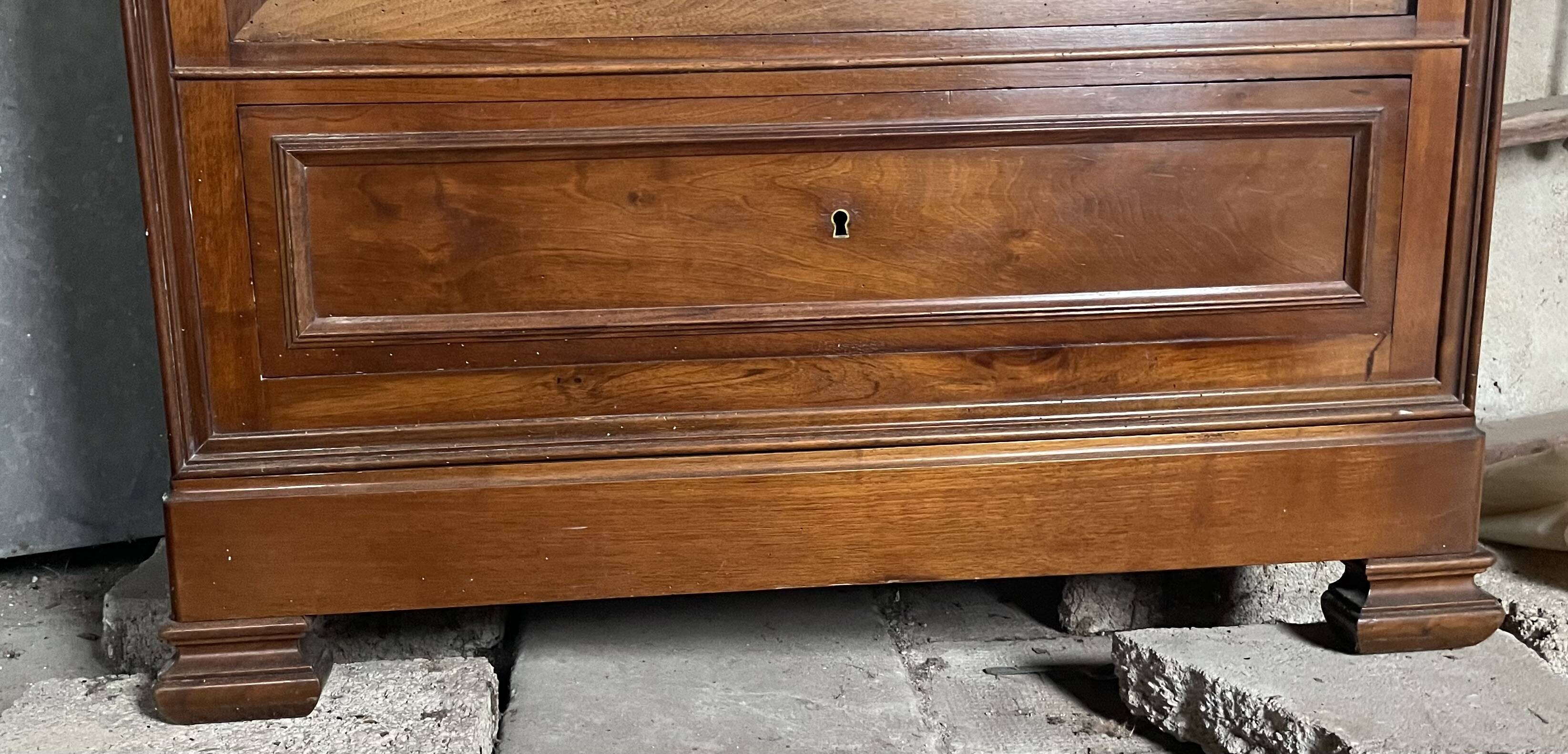 Antique wardrobe with a mirror door.