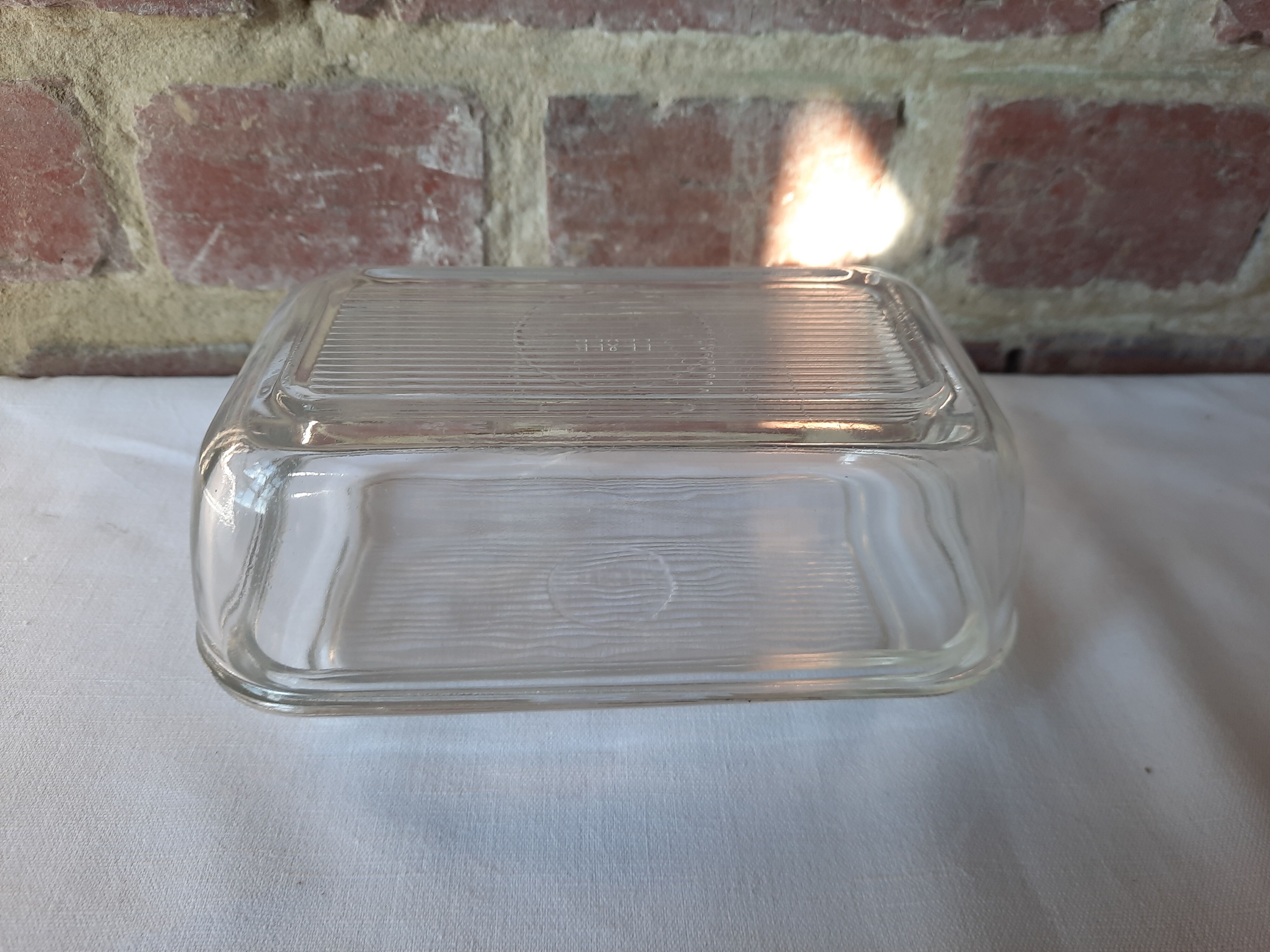 Transparent glass butter dish from lever