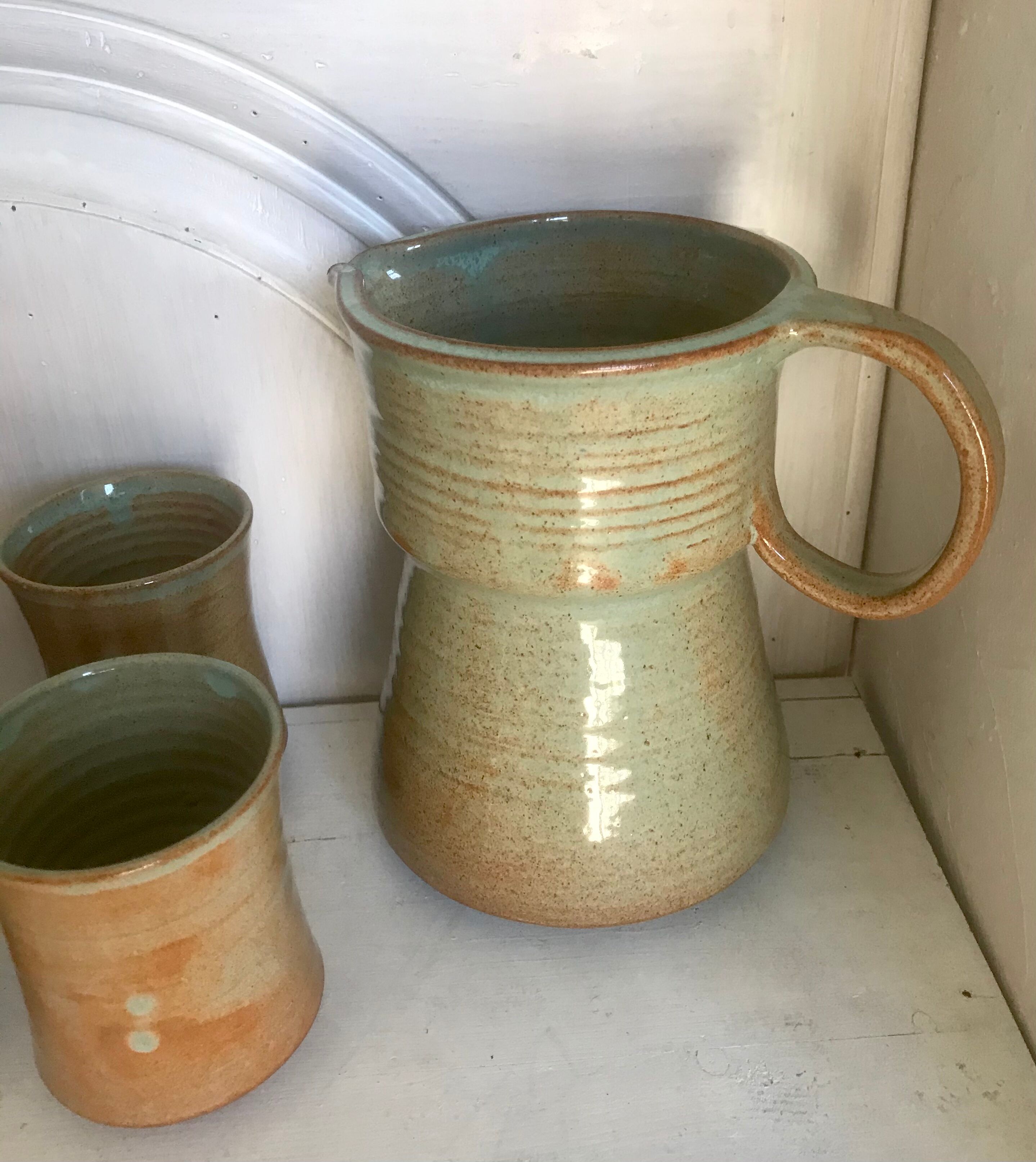 Pitcher and its vintage sandstone glasses