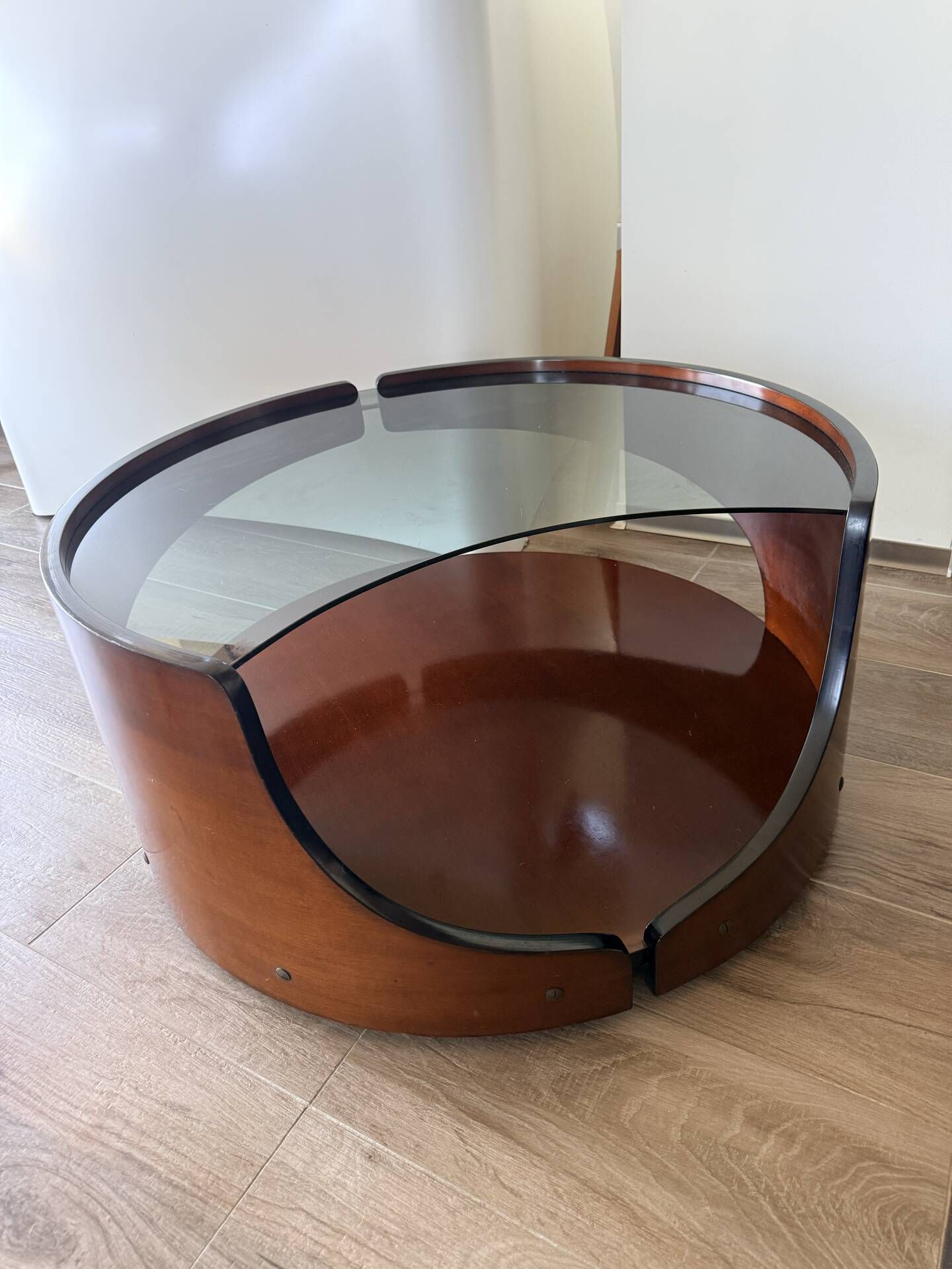 Italian Space Age coffee table in curved wood and smoked glass – 1970s
