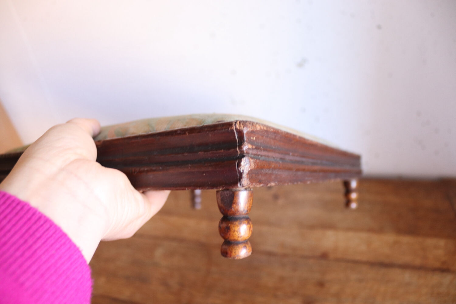 Small antique wooden and fabric footrest.