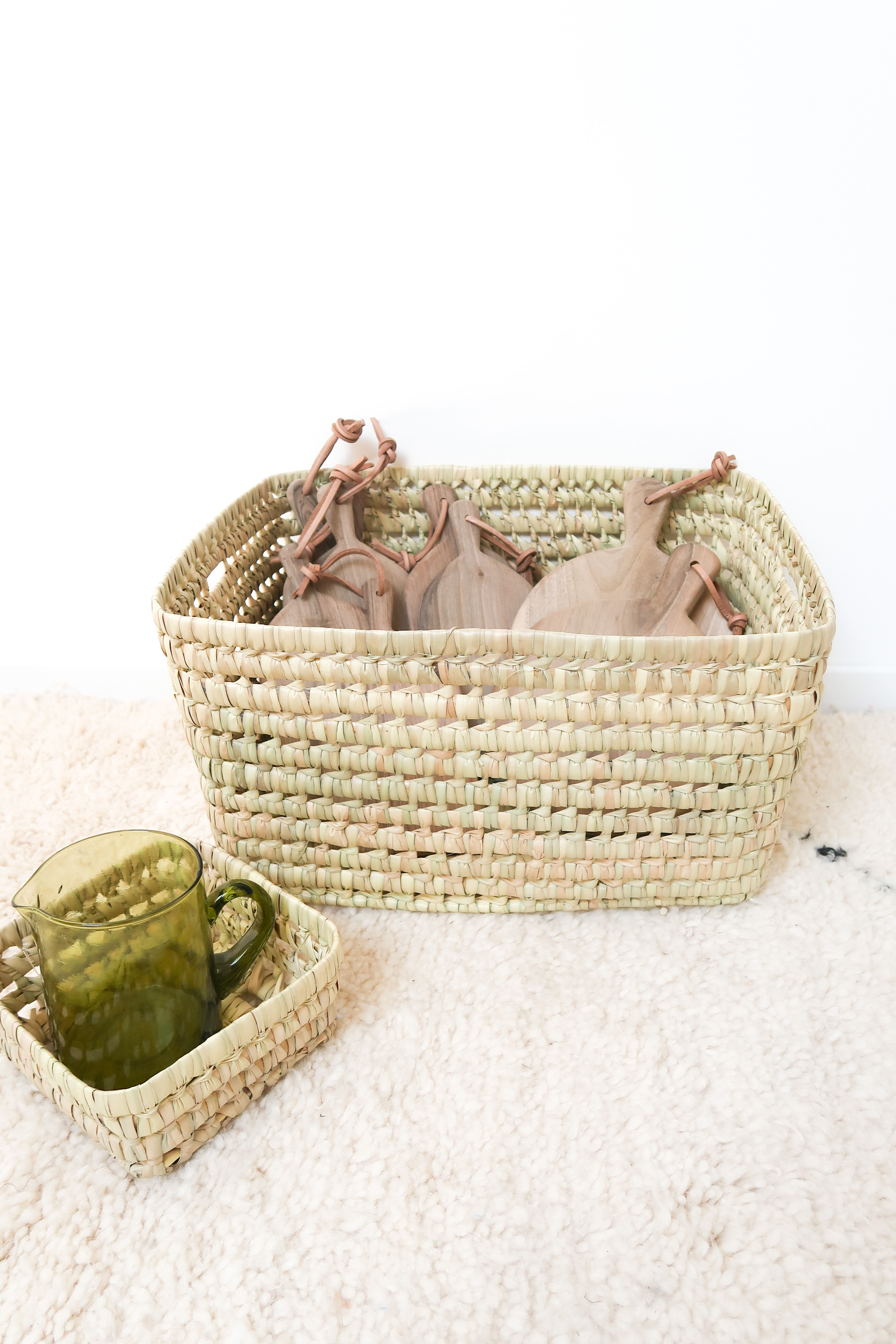 Storage basket in braided palm leaves