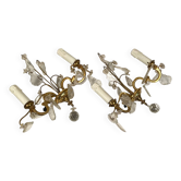 Pair of two-armed wall lights in gilded metal with pendants.