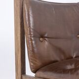 Pair of oak armchairs, upholstered in leather. Work from the 1960s.