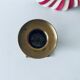 Old candle holder in brass and wood