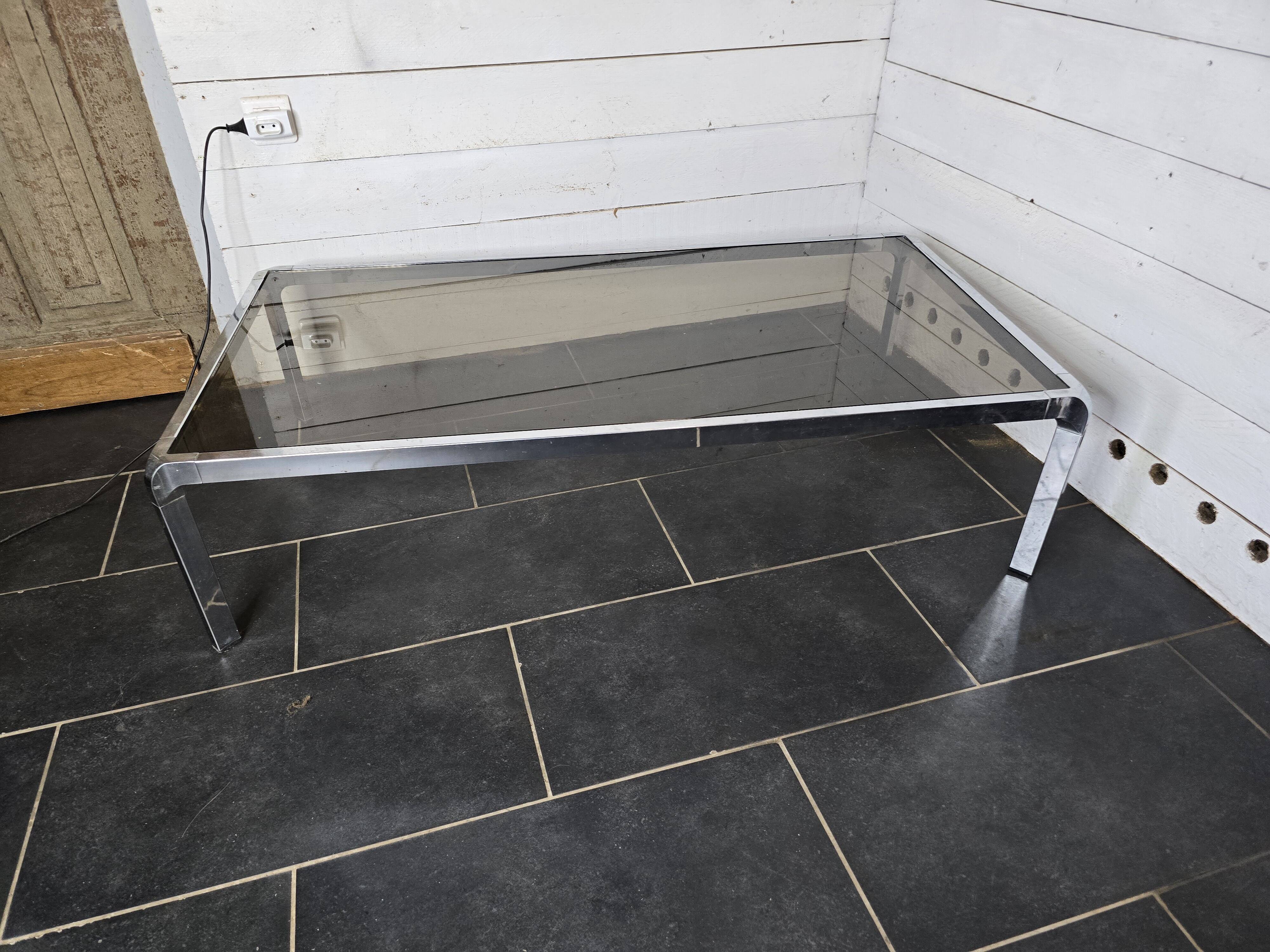 Chromed metal coffee table with smoked glass top from the 70s