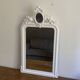 Mirror from the late 19th century with a decorated pediment. 112x66.