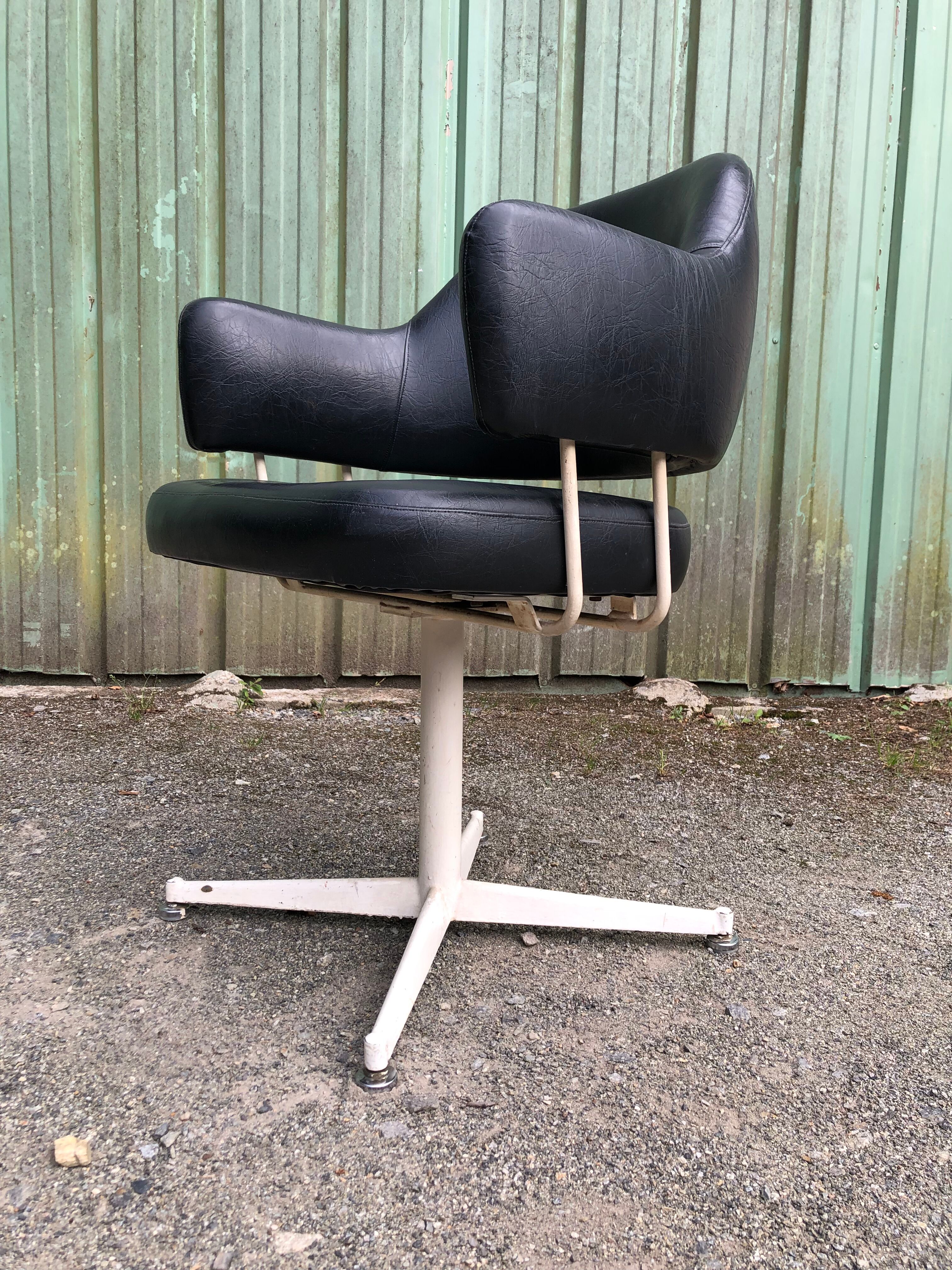Pair of vintage armchairs in black skai with metal legs.