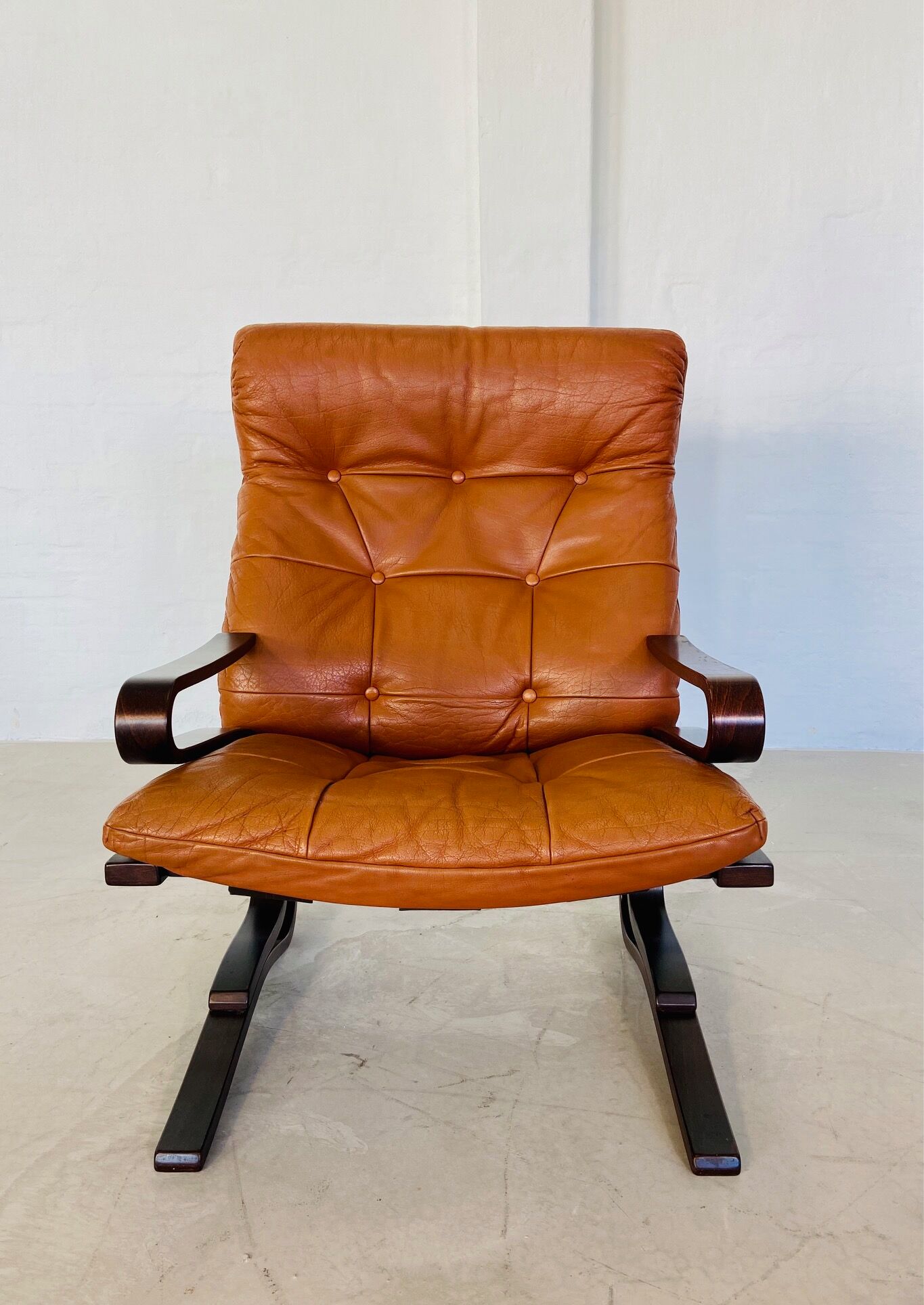 Vintage Scandinavian cognac lounge chair by Oddvin Rykken