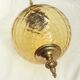Amber glass suspension with brass
