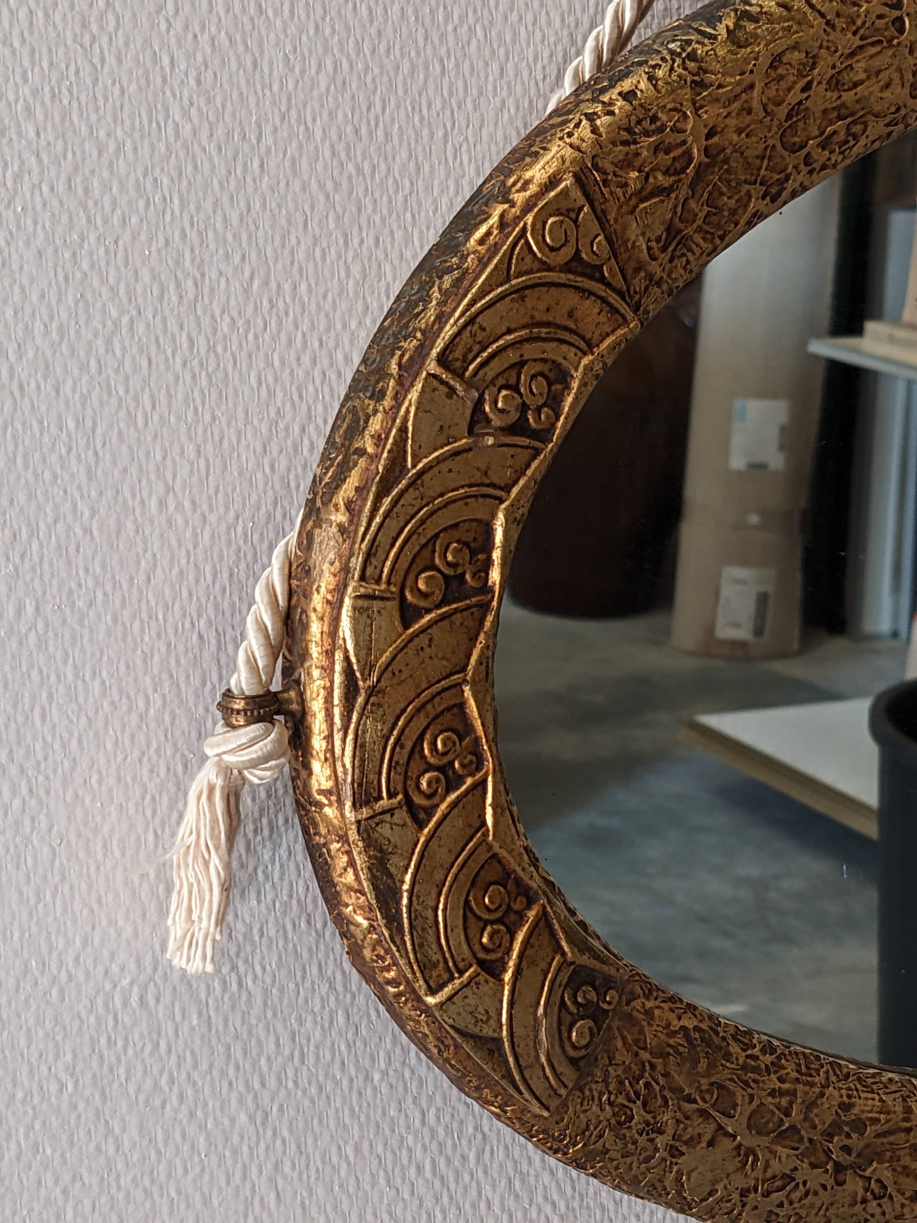 Art Deco oval mirror in gilded wood, France circa 1920