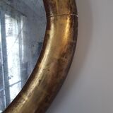Oval mirror with gold leaf