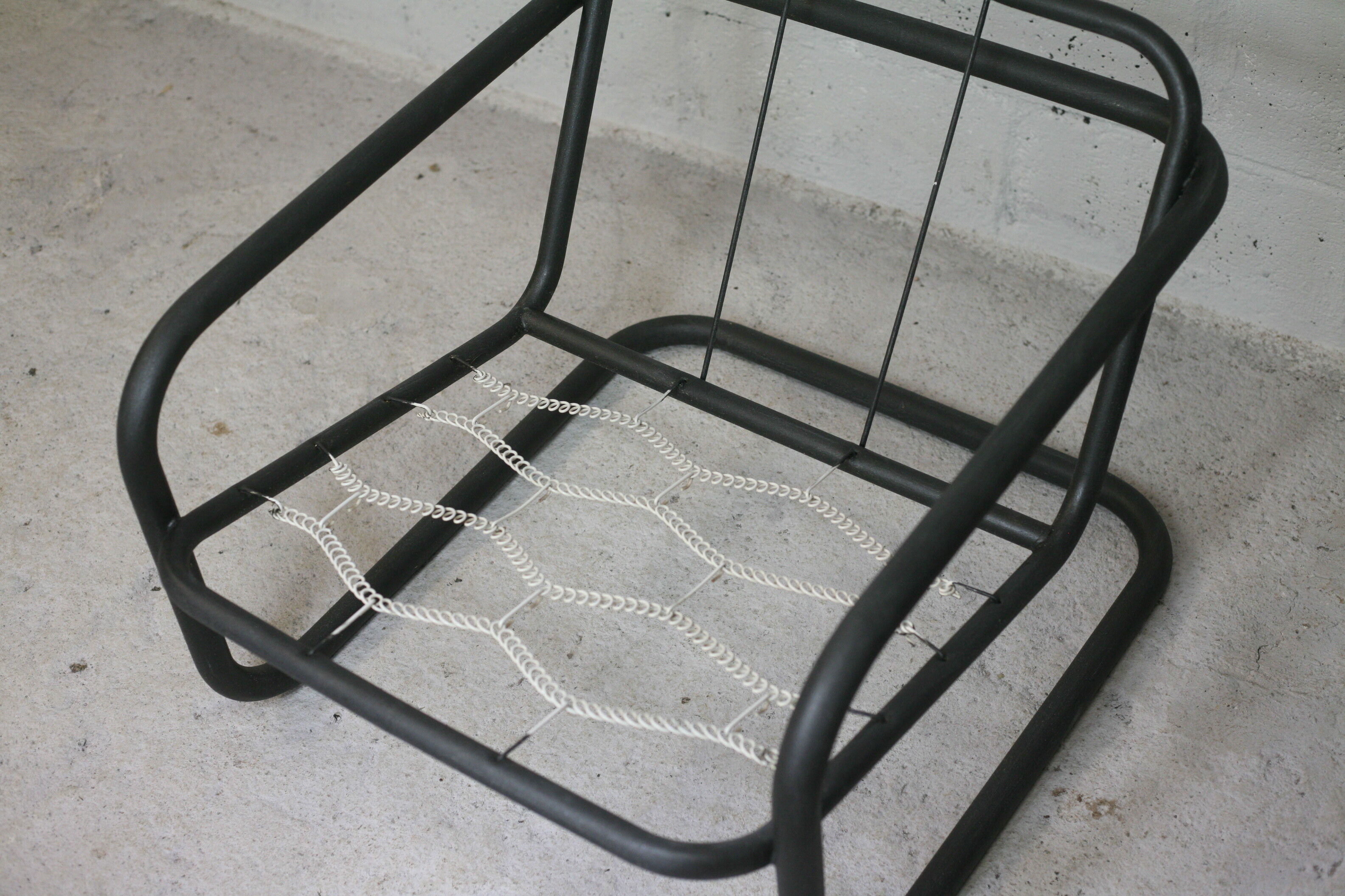 Pair of Prisunic edition armchairs, tubular steel and foam cushions, France, 1973