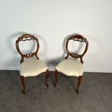 Pair of Victorian English chairs known as balloon chairs in solid mahogany.