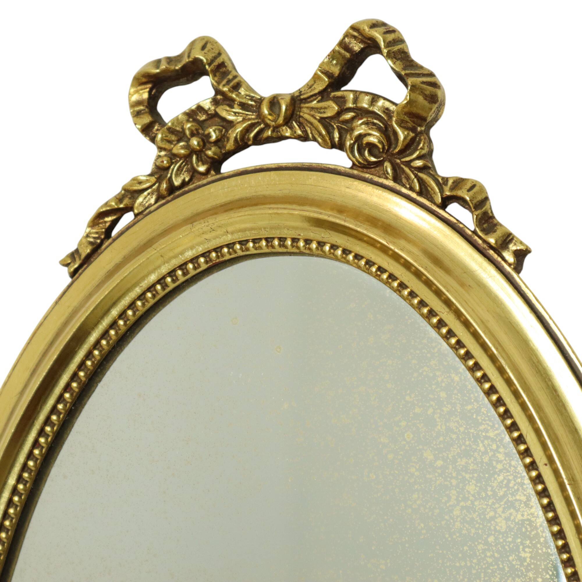 Miroir ovale classique doré à décor de ruban, France