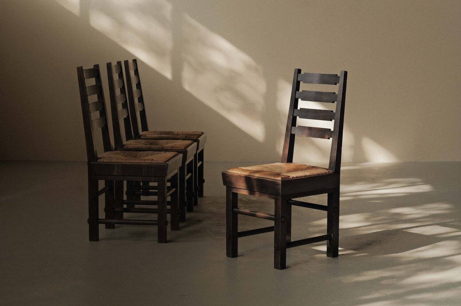 Modernist chairs in oak and woven straw, France, circa 1948
