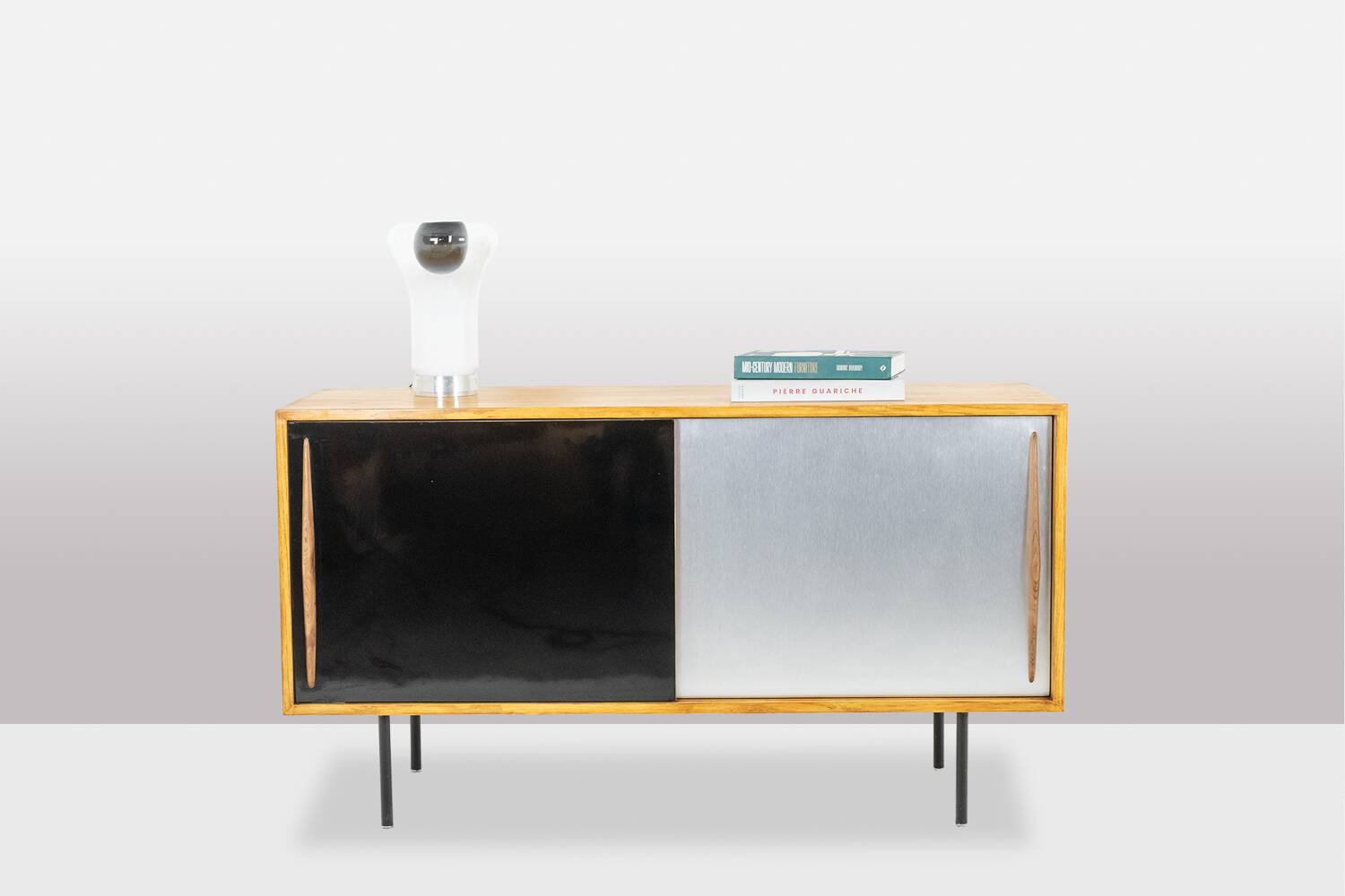 Low ash sideboard with sliding doors. 1960s.