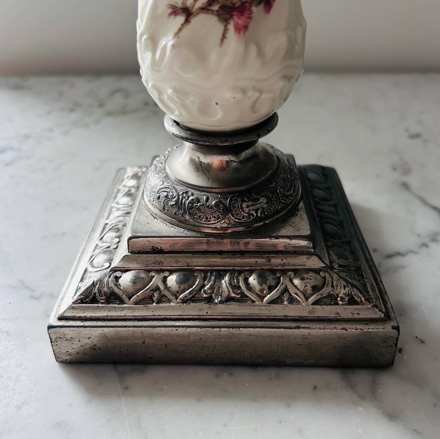 Silver-plated metal and porcelain candlestick